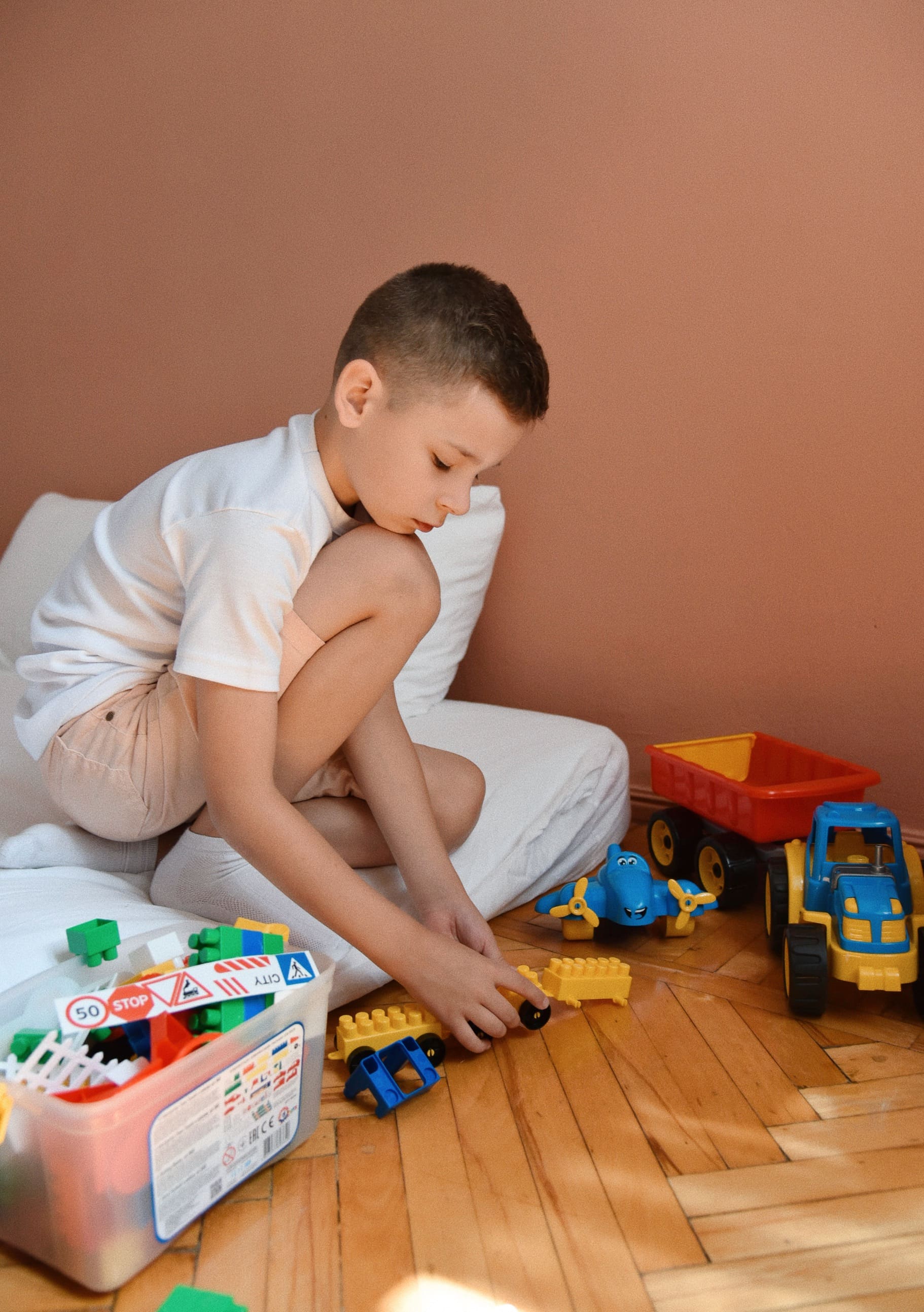 Strateg toys distract a child during an air raid alert - Alexander Sivak